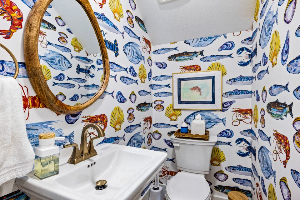 The main floor half bath is convenient for everyone! You'll feel like you are swimming in the ocean!
