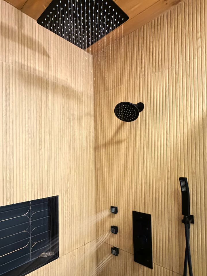 Indulge in the ultimate shower experience featuring a large overhead rain shower, additional shower head, three powerful body jets, and handheld sprayer. Let the jets melt the stress of the day away!