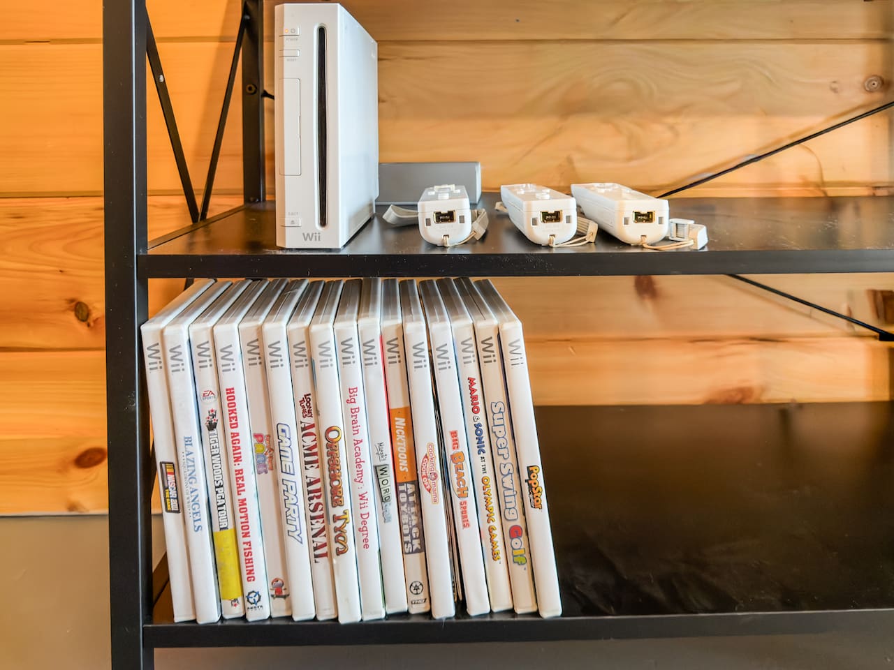 Movie room right off the game room includes big screen smart TV with streaming available, DVD player, and Wii video games!