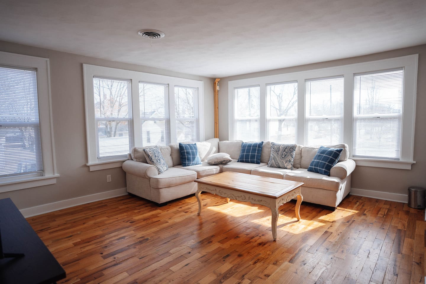 Kick back on the comfy couch, put your feet up on the coffee table, and enjoy your favorite shows on the smart TV. It’s a great spot to relax, hang out, and unwind after a long day.