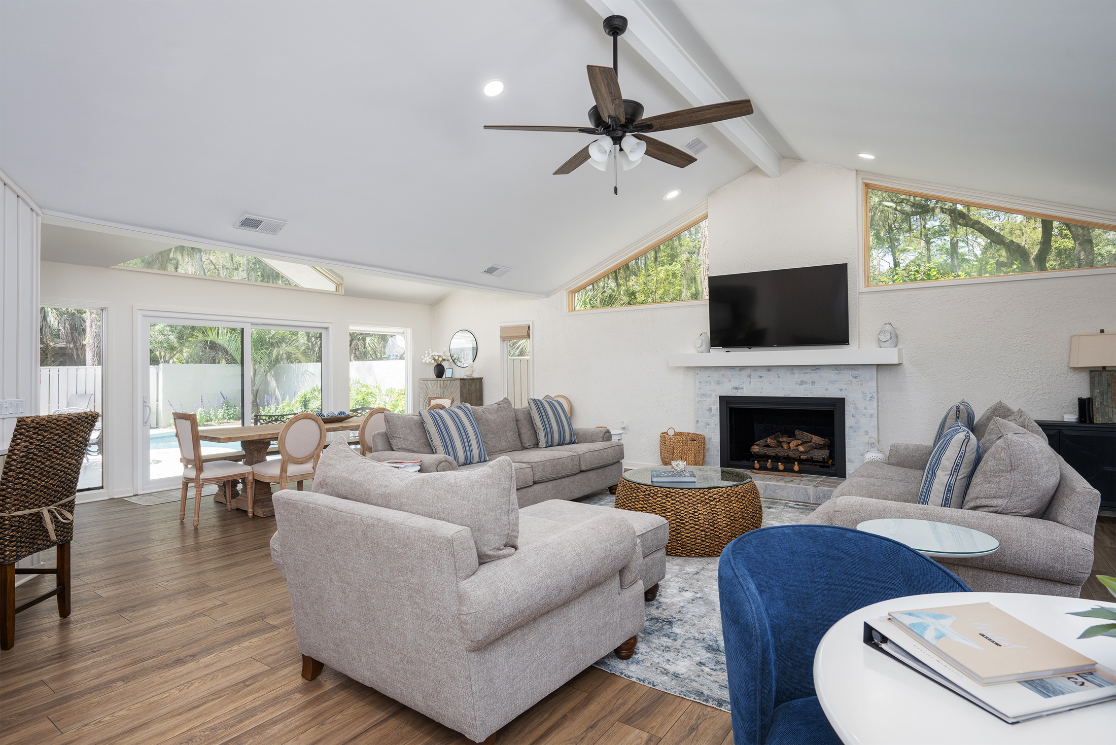 Living room and dining room with great view of the pool and deck