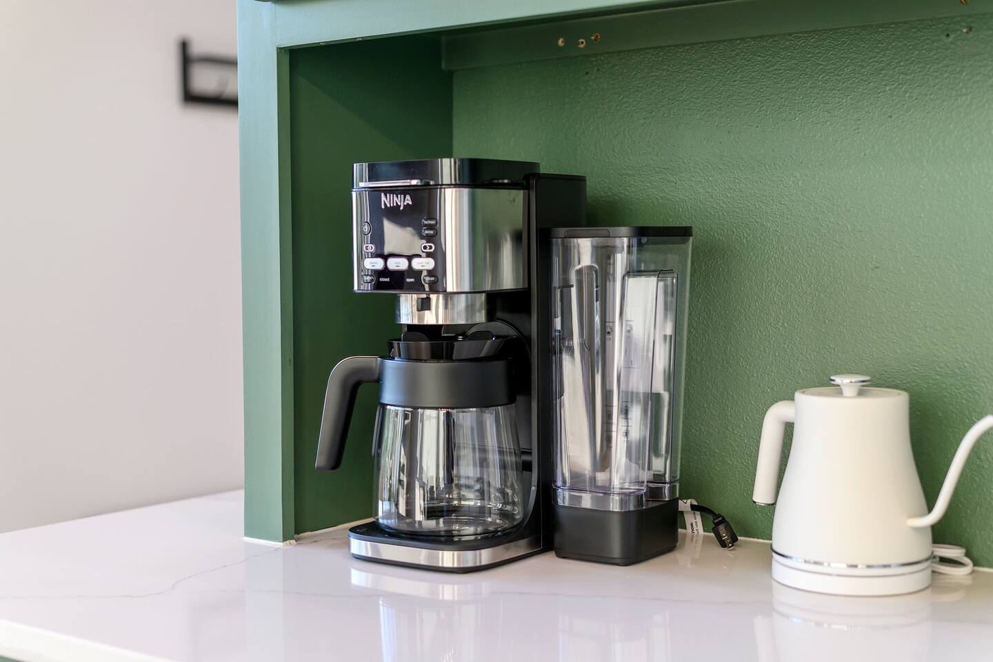 Premium coffee-maker and electric kettle. All coffee grounds, pods, sweeteners, and creamers are provided complimentary.
