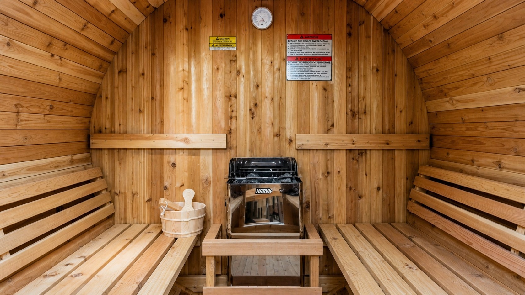 Cedar sauna interior with bench seating and heater—perfect for relaxation