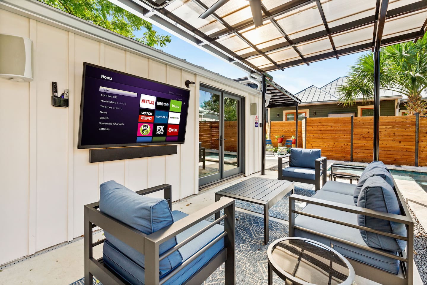 Private retreat surrounded by wood fencing with lounge chairs and shade for ultimate privacy.