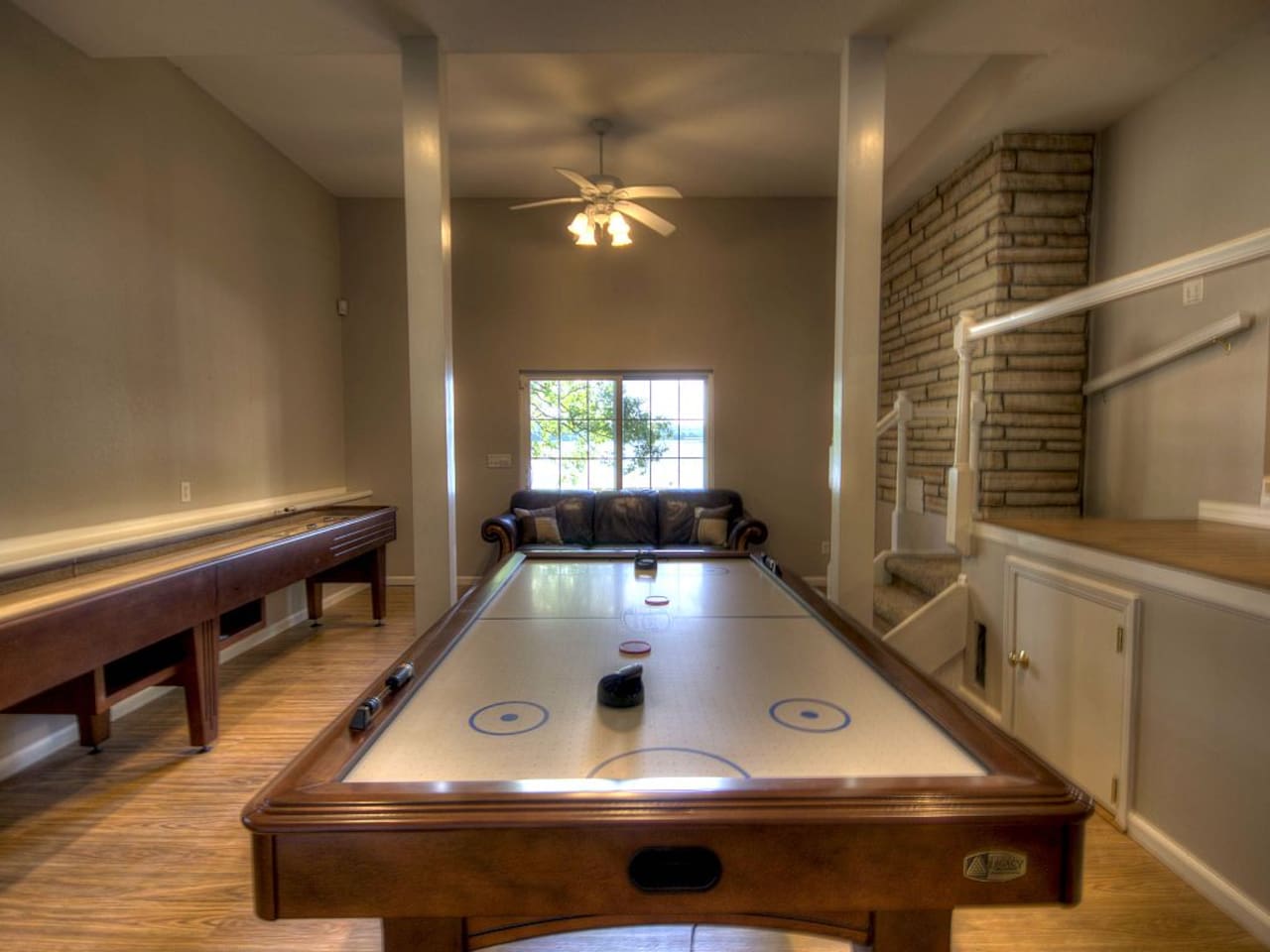 Enjoy playing shuffleboard, air hockey and pool table. Lake view.