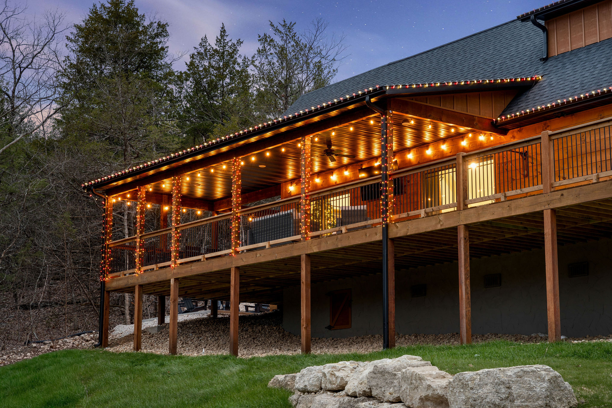 Spacious deck wraps the cabin, offering plenty of outdoor space.