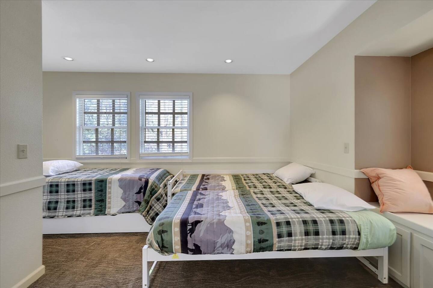 Bedroom 3 with three twin beds and a simple setup for kids, friends, or extra guests.
