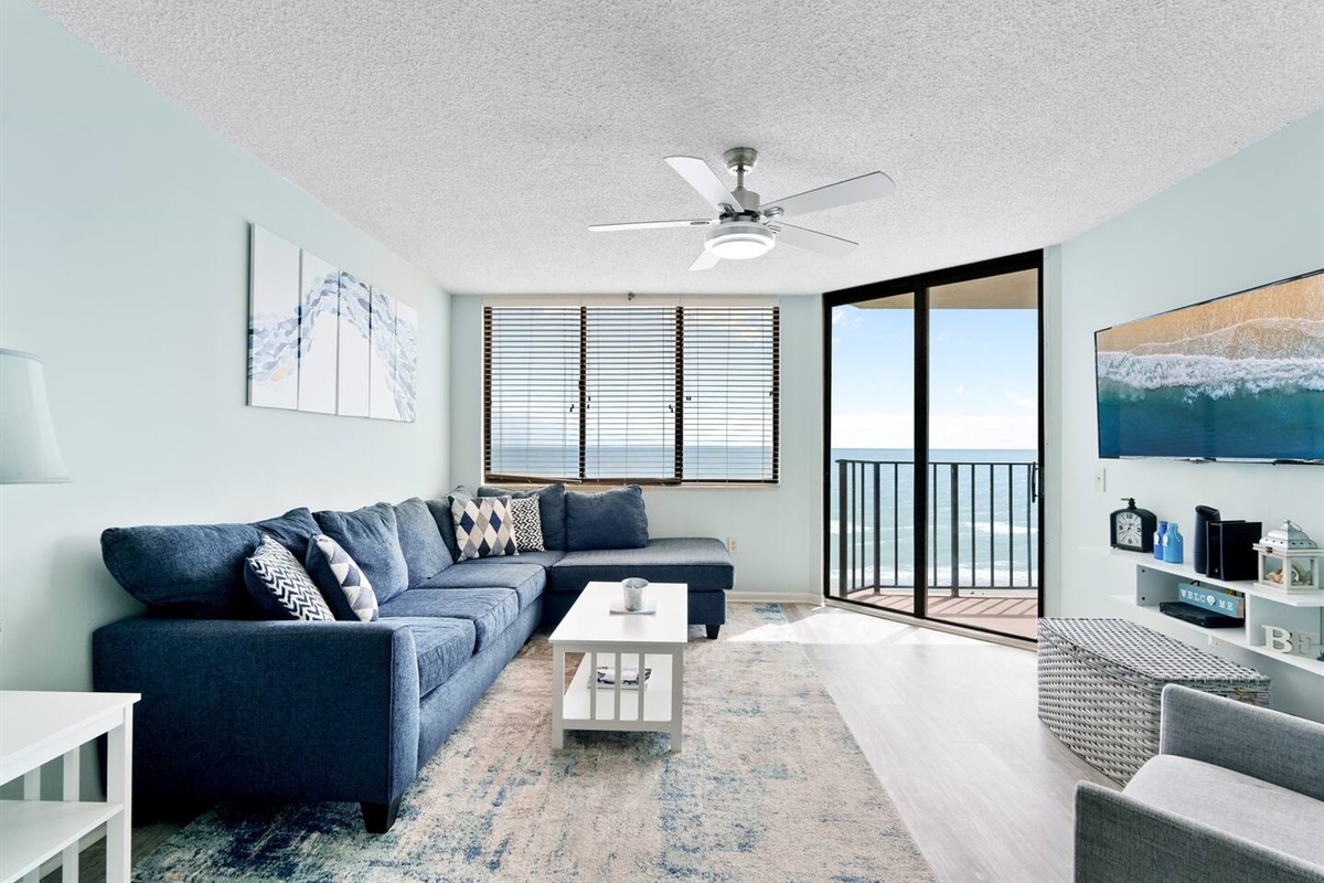 Living room with sectional sofa and ocean view