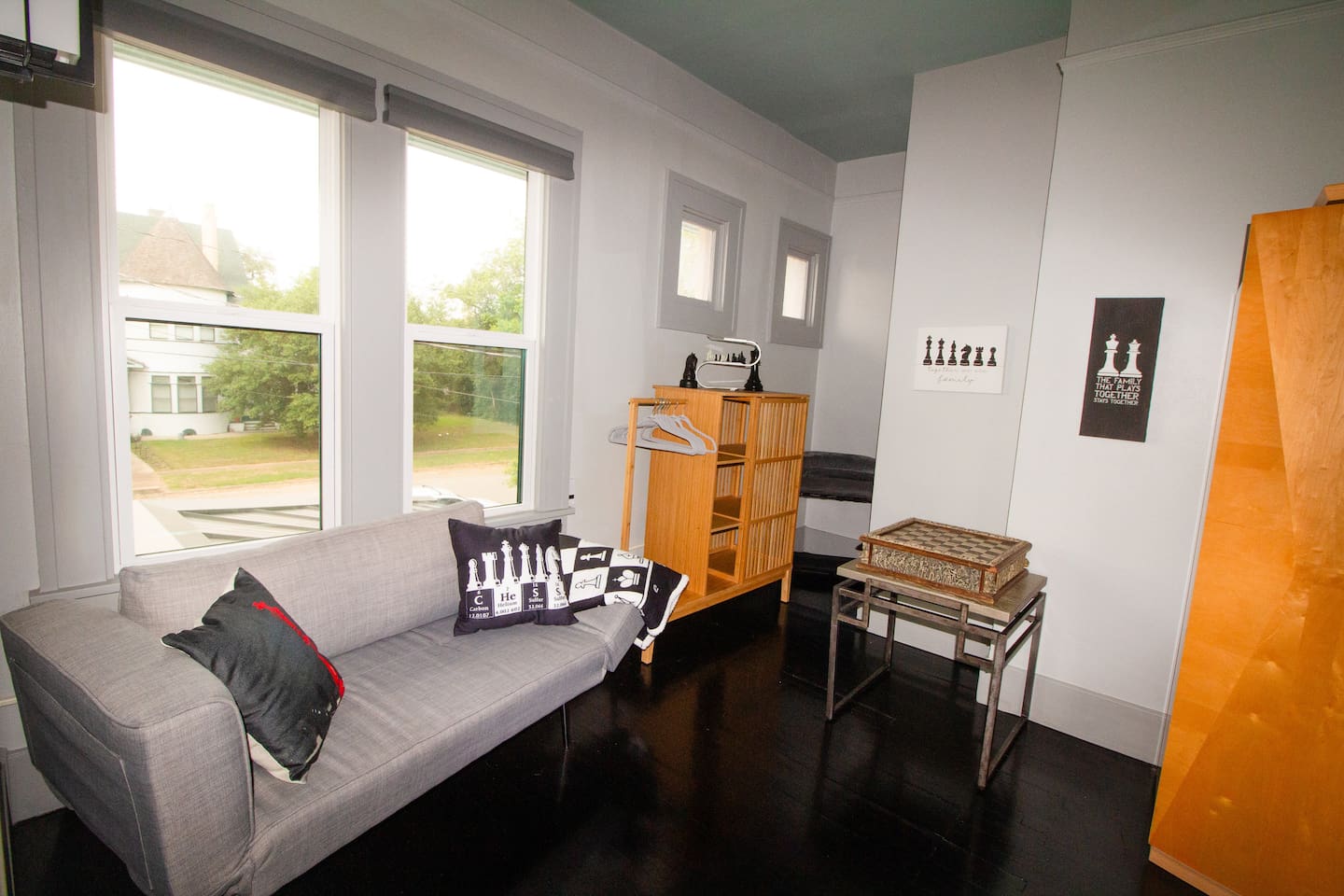 Sitting area is a quiet spot for playing Chess, a glass of wine, watching old movies, or playing video games. It is a flexible love seat that can hold a small child. Storage for personal items is generous for longer stays. 