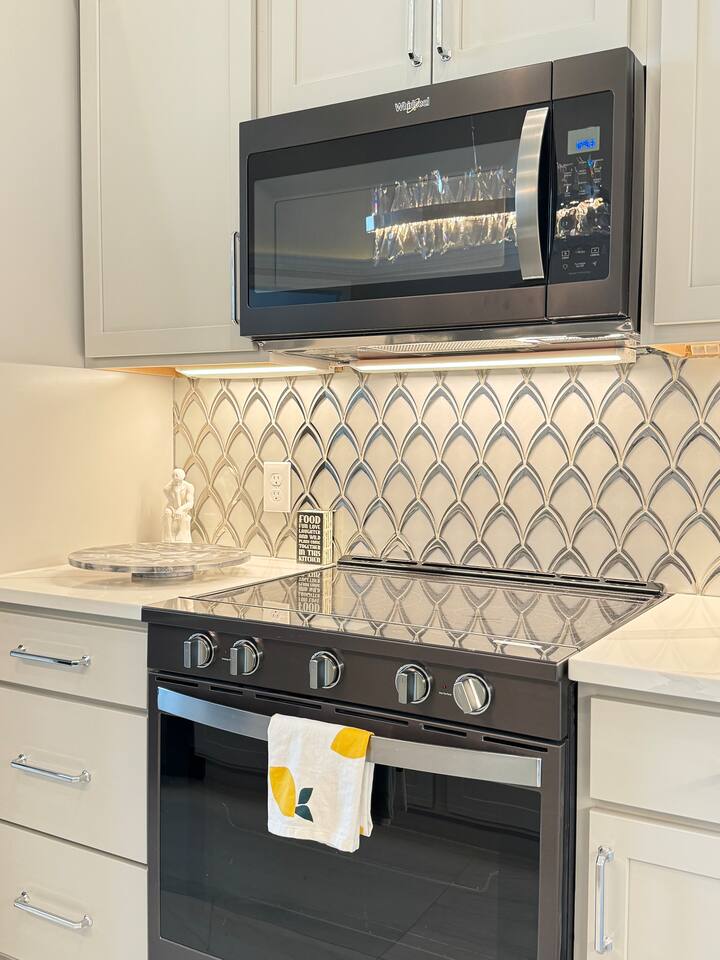 Microwave, electric range, refrigerator, ice maker, and basic kitchen spices available. 