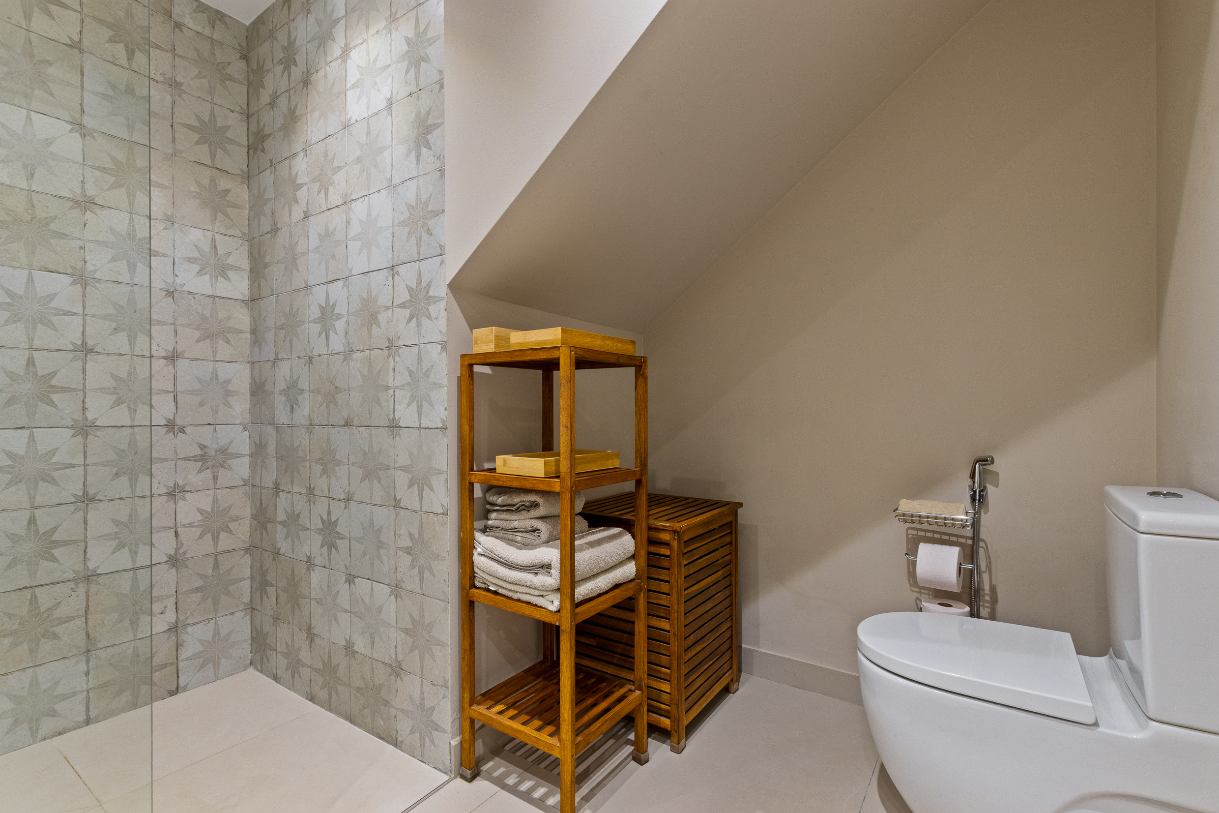 Bathroom detail with additional storage and toilet area