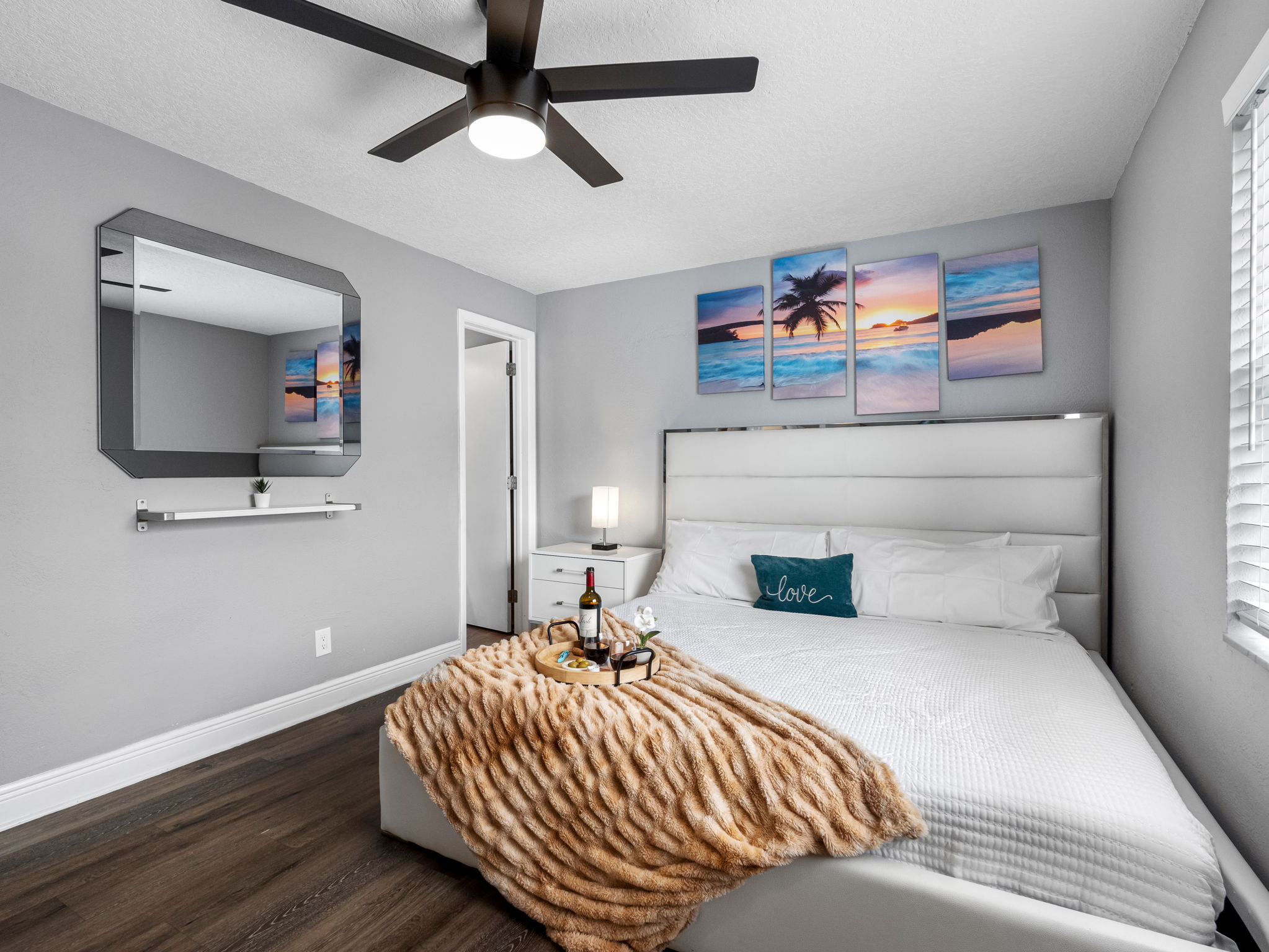 This serene bedroom combines sleek modern finishes with soft textures, creating a calming retreat ideal for rest and relaxation.