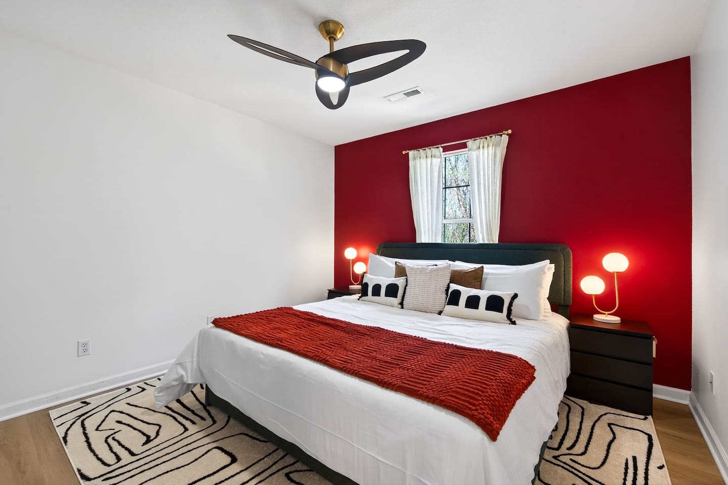 Third bedroom with a comfortable king bed .