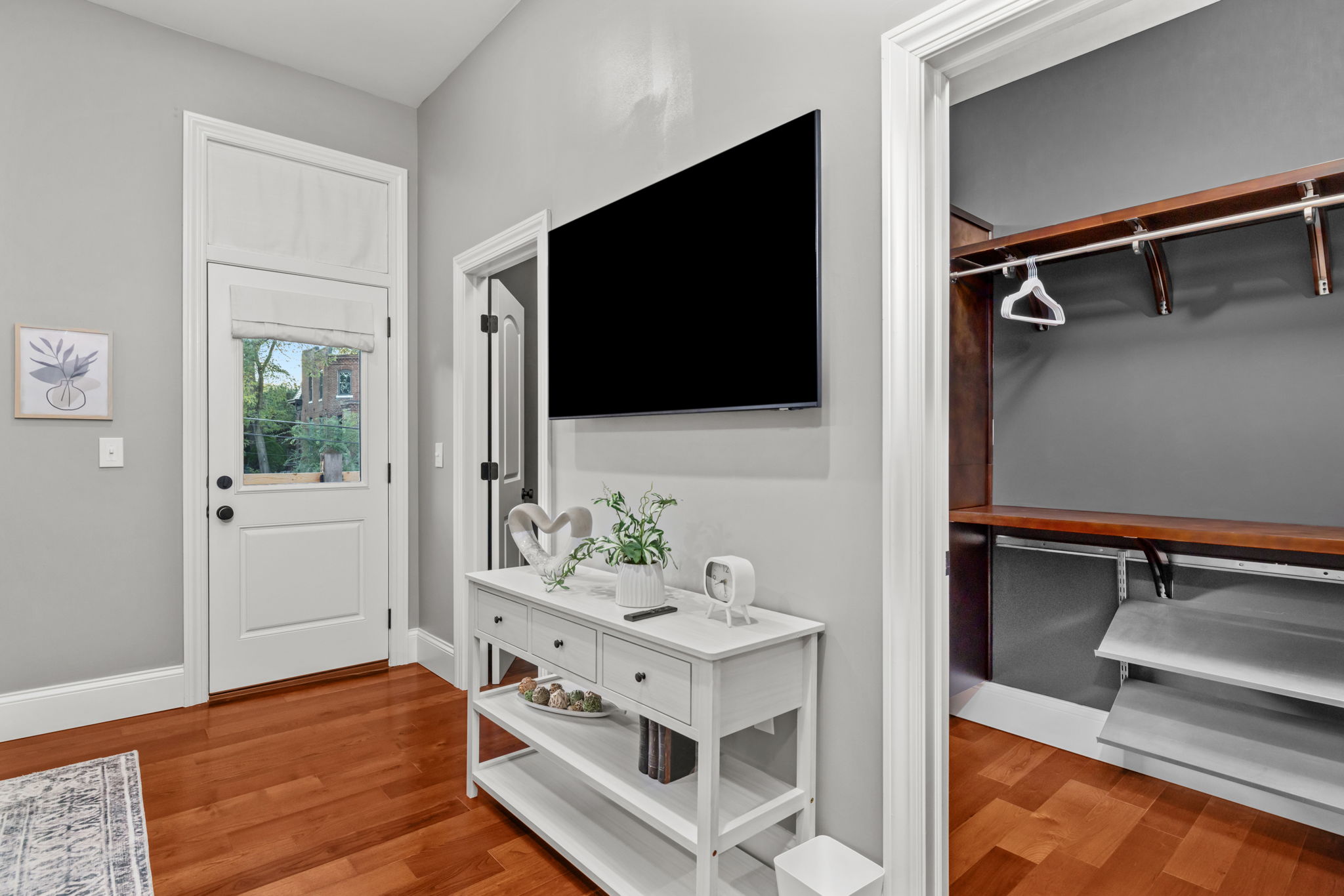 Walk-in closet provides ample space for storing your personal items, and there is easy access to the private balcony overlooking the back yard.