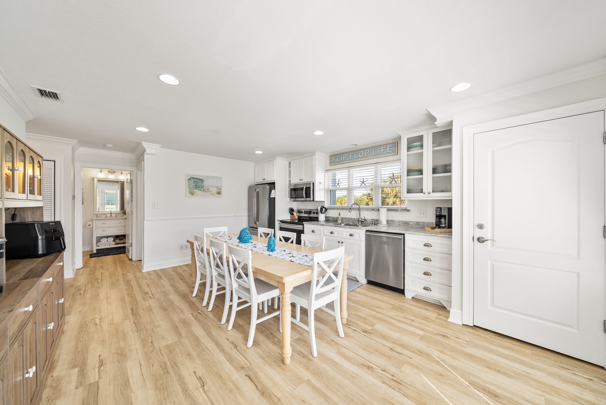 2nd floor includes the large kitchen, dining room, queen bedroom, and full bathroom.