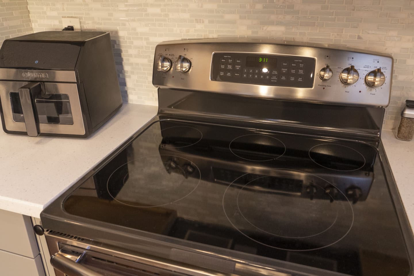 Electric range and air fryer available for quick meals, snacks, or longer-stay cooking.