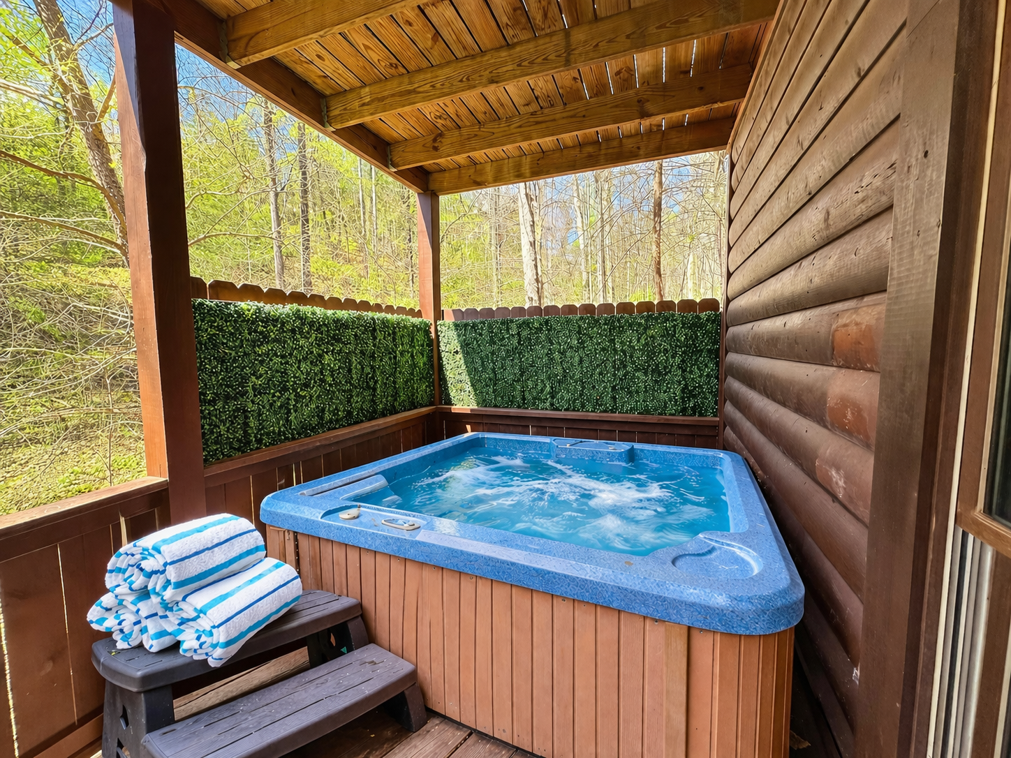 Soak in the private hot tub surrounded by peaceful Smoky Mountain woods