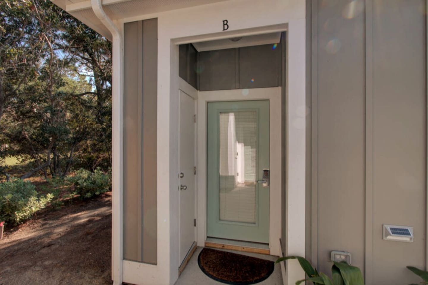 Entrance to the unit. A lockable storage closet (left side of the door) is available for storage of your beach gear. 