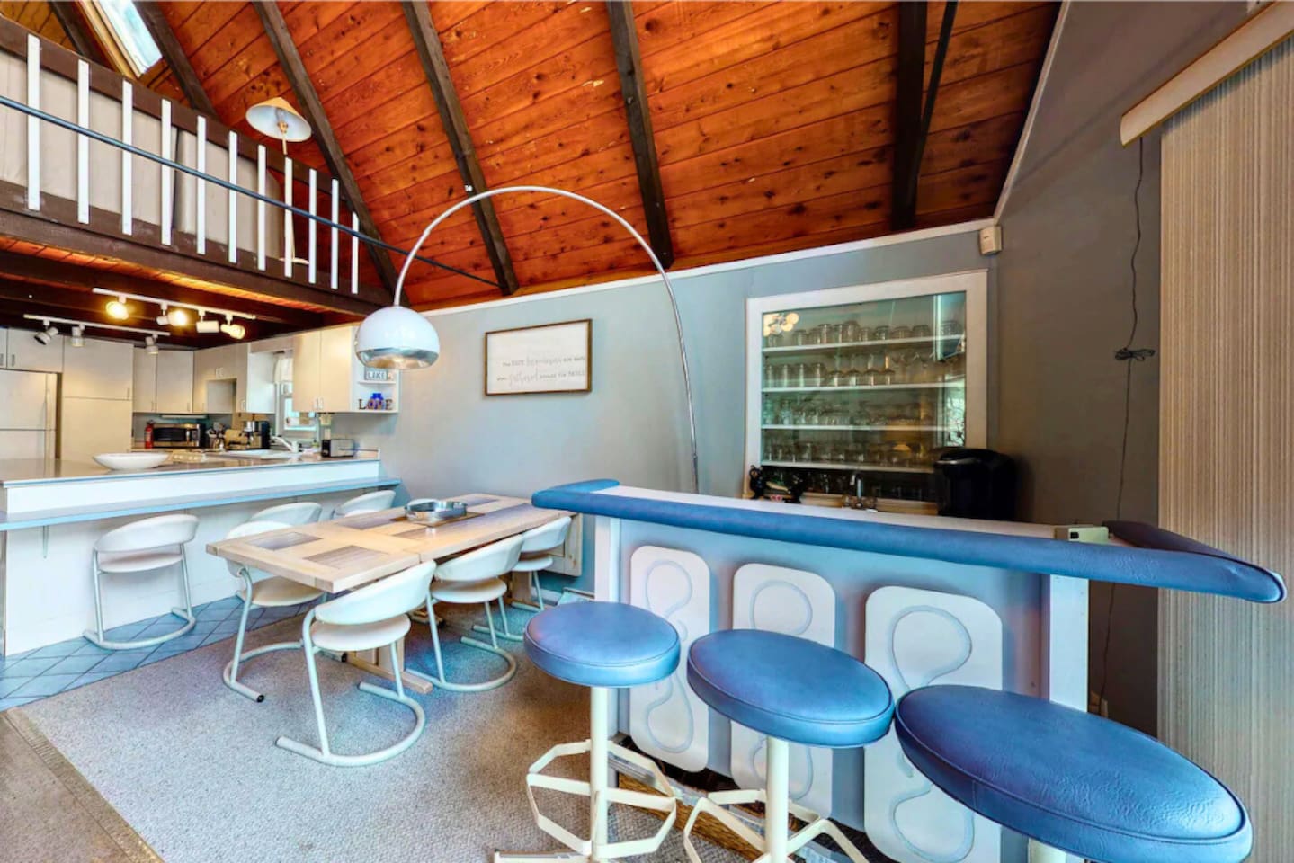 Enjoy serving guests at the bar in the cozy lakeside cabin! 