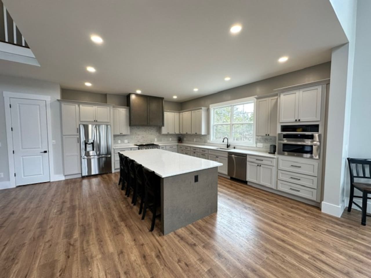 Island seats 5 with an additional two stools in the dining area. Kitchen table upgrade coming soon to accommodate even more guests. Plenty of pantry space, kitchen appliances, dishes, mugs, etc. 