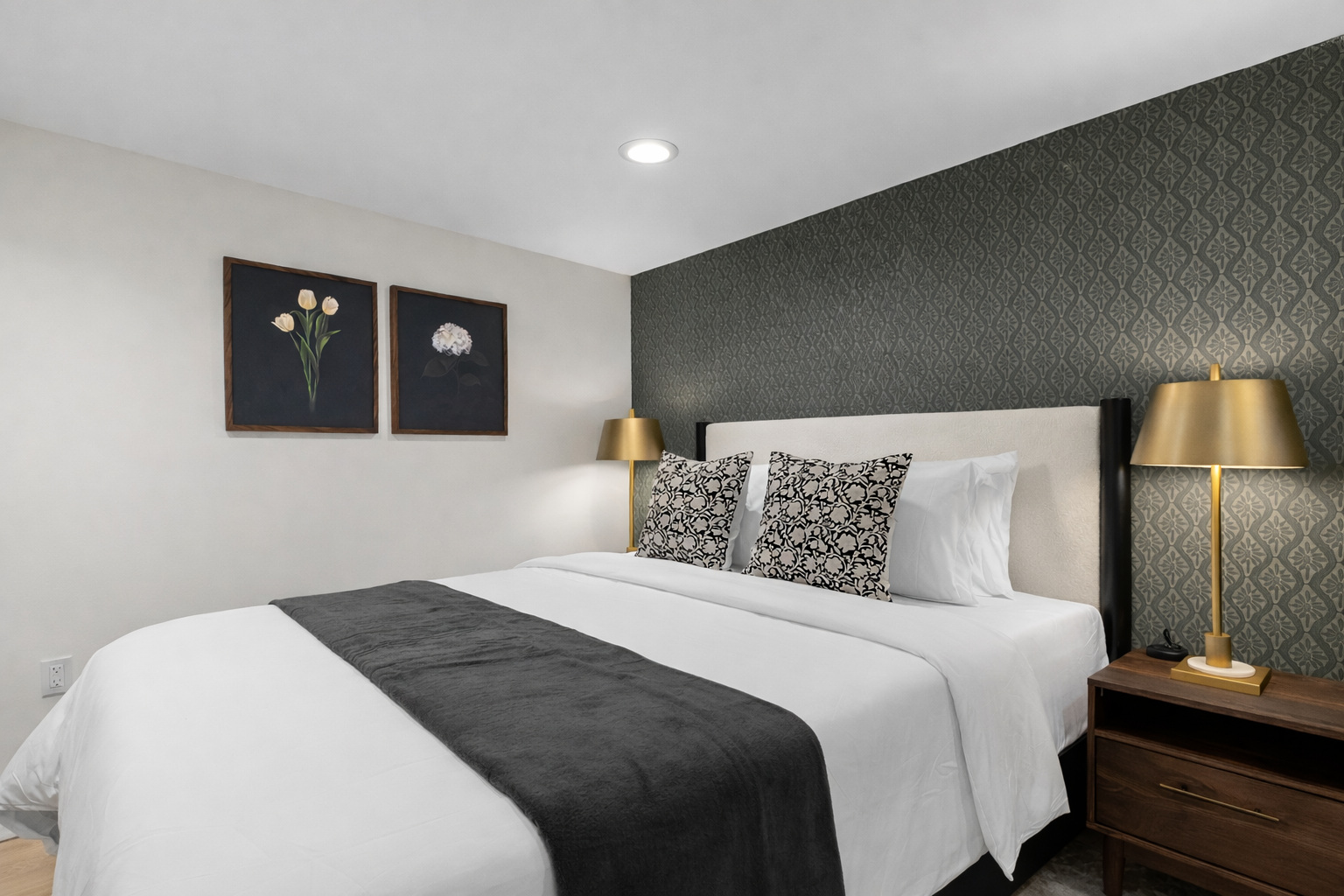 Calm, inviting bedroom with a comfortable king bed, crisp linens, and warm bedside lighting—perfect for unwinding and enjoying a peaceful night’s sleep.