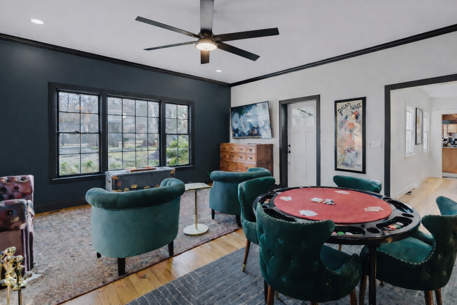 Spacious main living area with lounge seating and a poker table for evening entertainment.