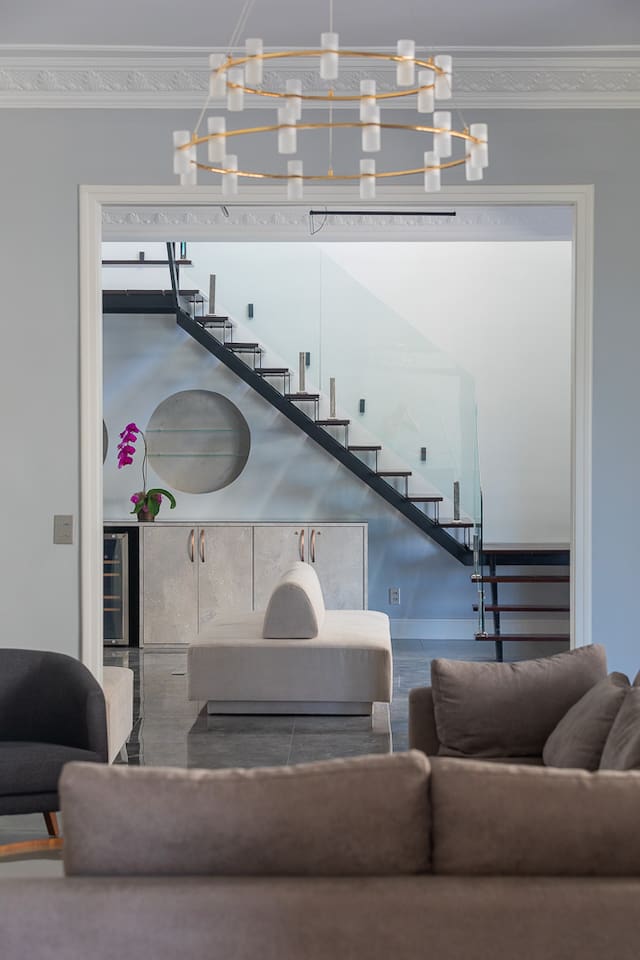 Two bedrooms and bathrooms on upper floor accessed by this modern staircase.  All other rooms are on main floor of penthouse -- the 11th floor -- with two elevators from ground.  We have the entire 11th floor and upper floor. 