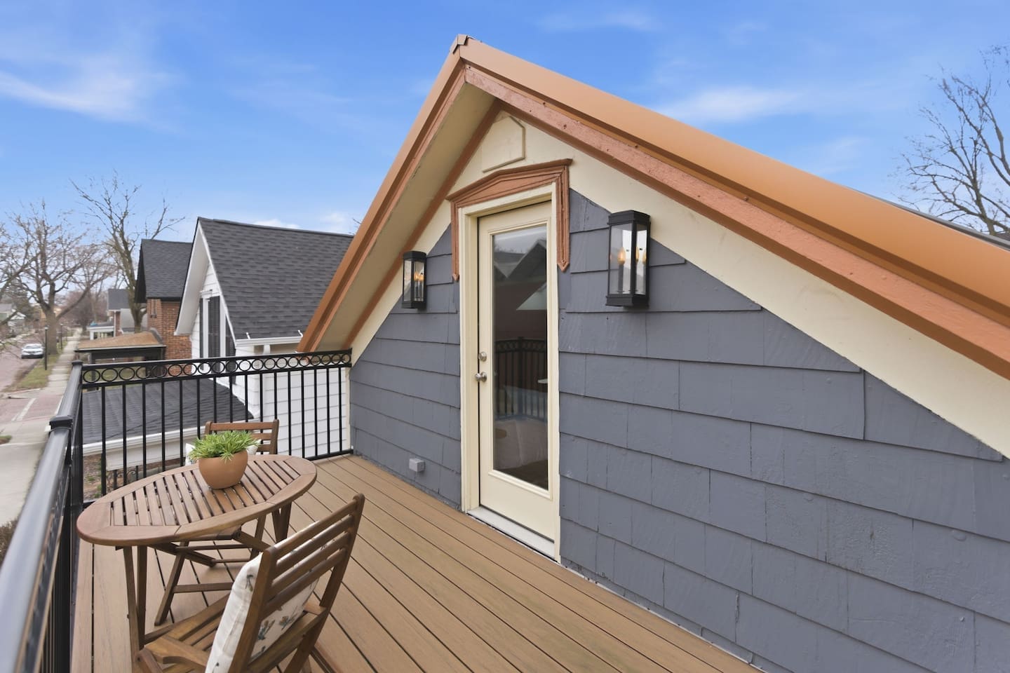 Charming outdoor deck with table and chairs, ideal for morning coffee or evening relaxation