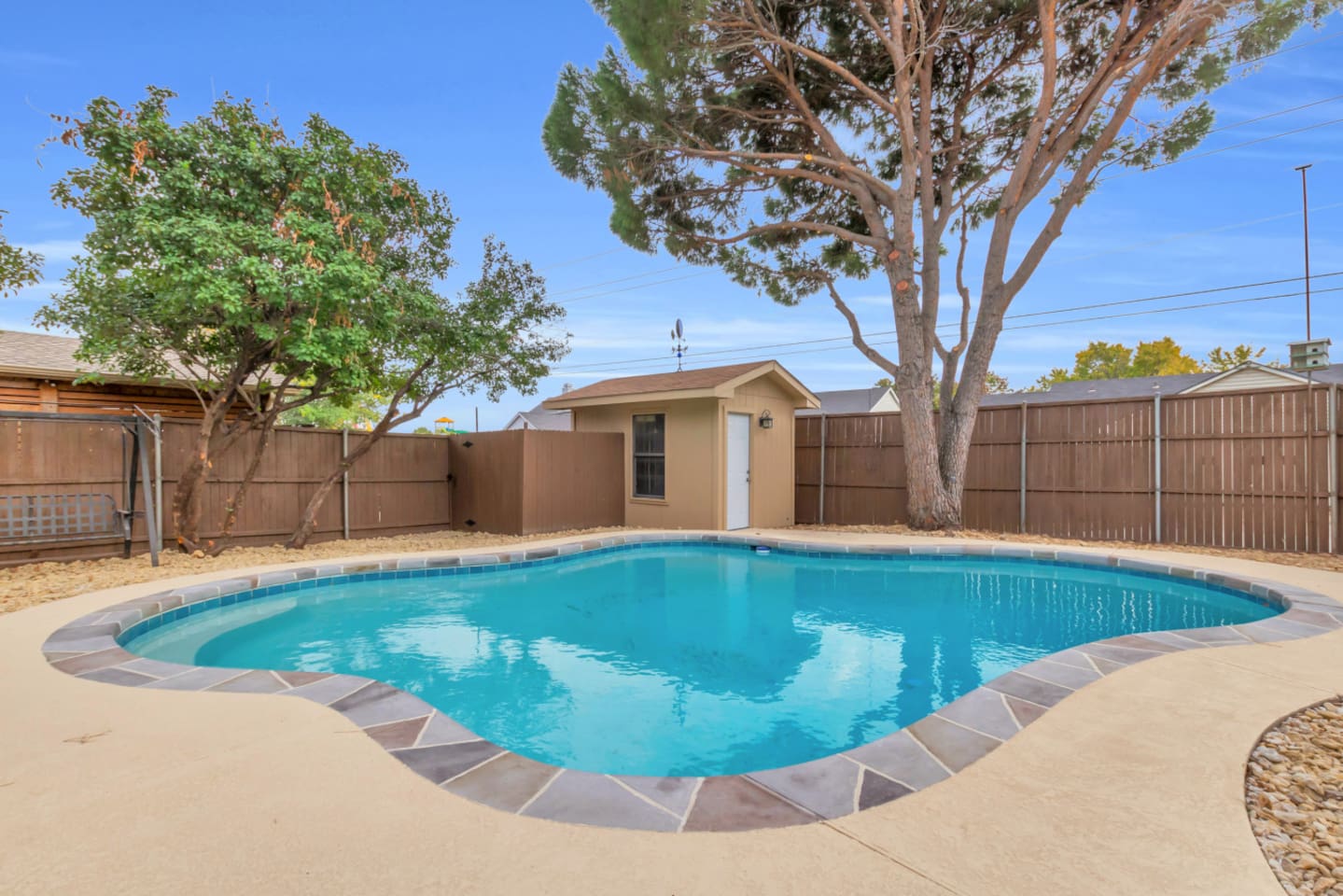 Crystal-clear private pool in a peaceful fully fenced garden, offering plenty of space to lounge and relax.