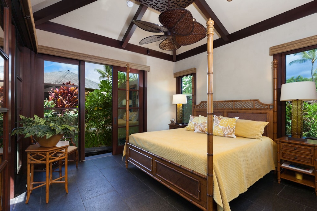Bedroom 2 overlooks the Koi Pond and features and ensuite bathroom and outdoor shower