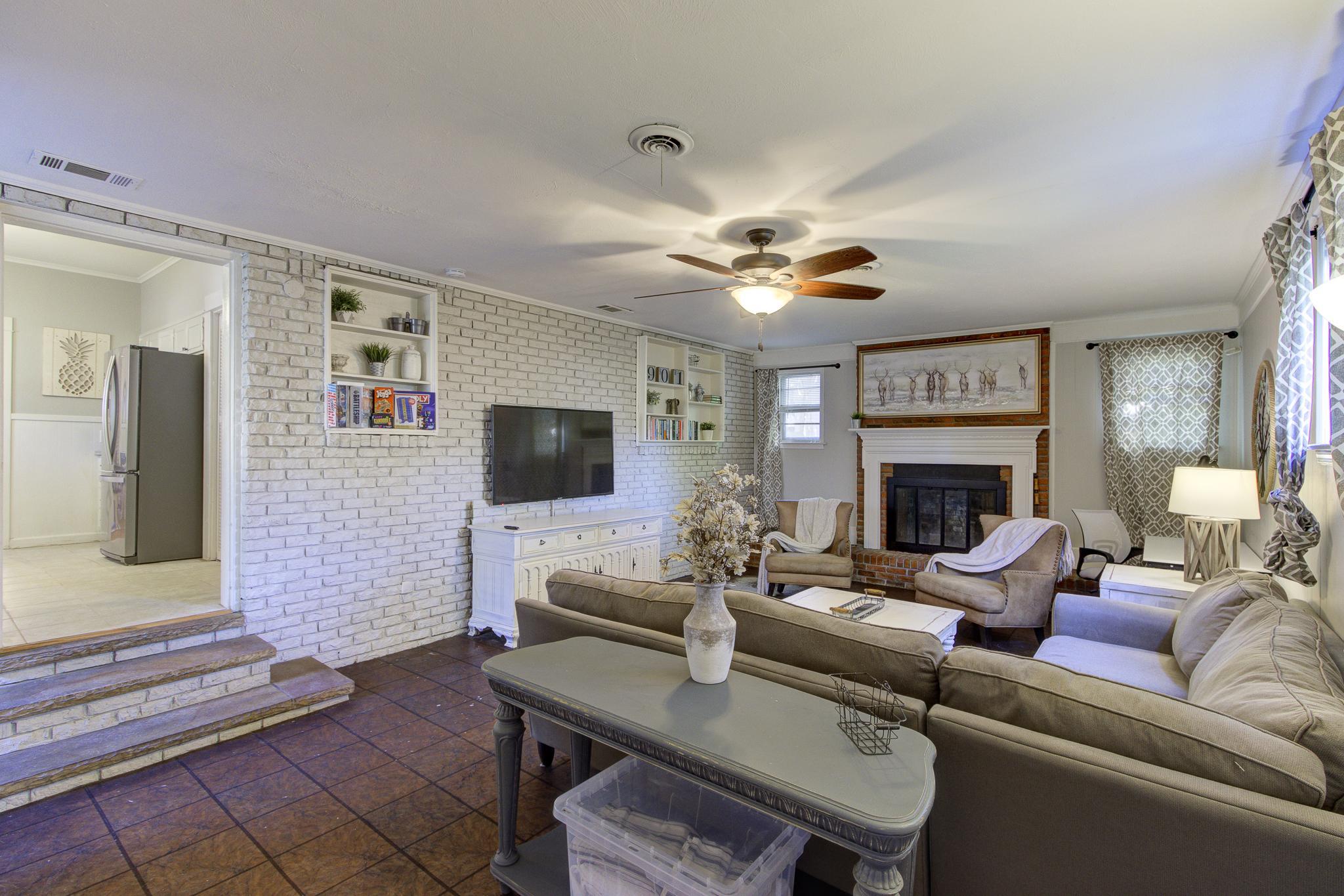 Spacious 2nd living room with desk, TV, and full size pull-out sofa bed