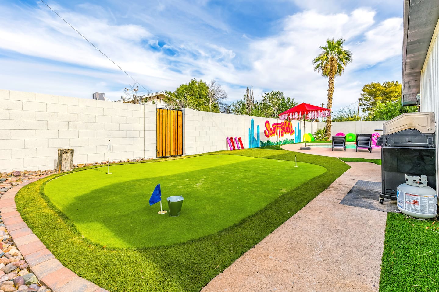 From the lush turf to yoga mats and playful art, this yard is made for Insta-worthy memories and carefree vacation days.