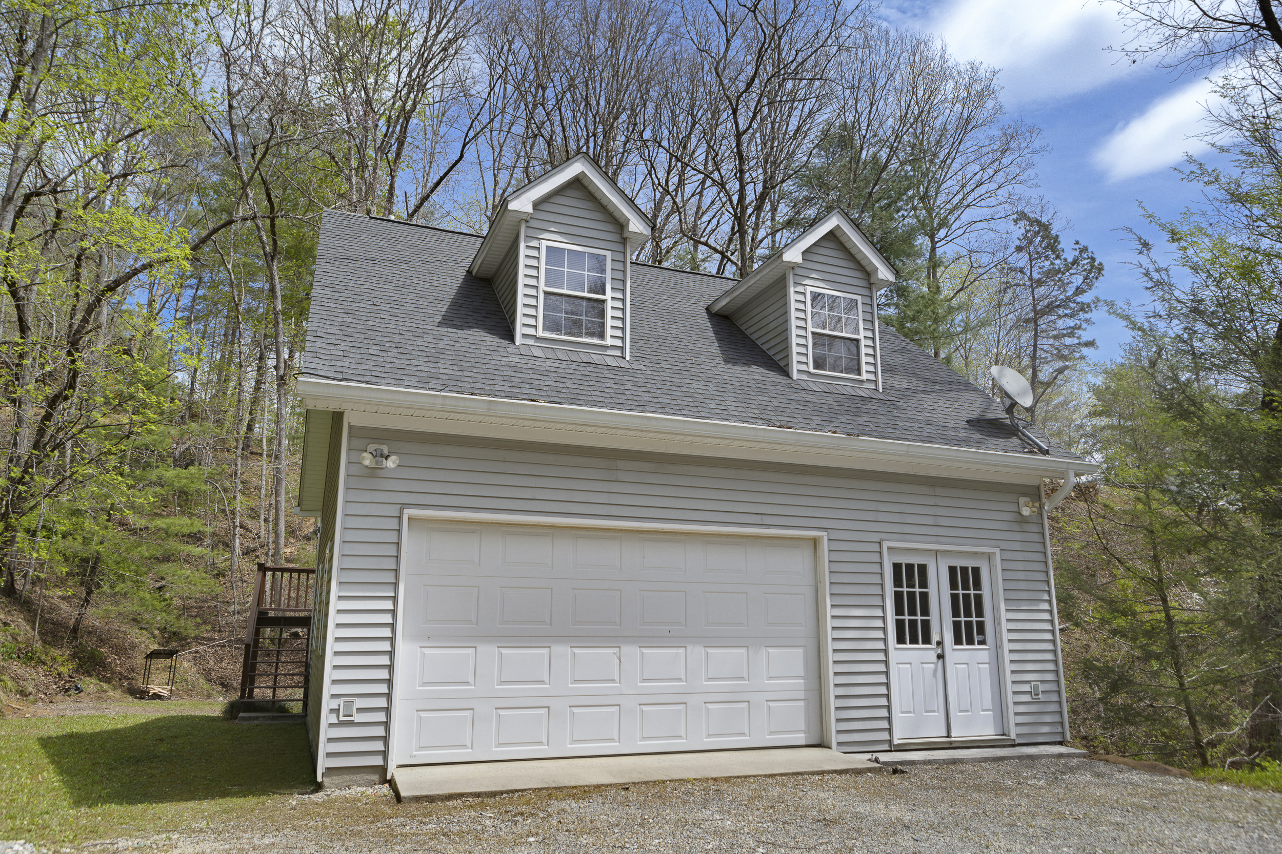 Exterior: Nestled among trees, this charming mountain retreat welcomes your adventure!