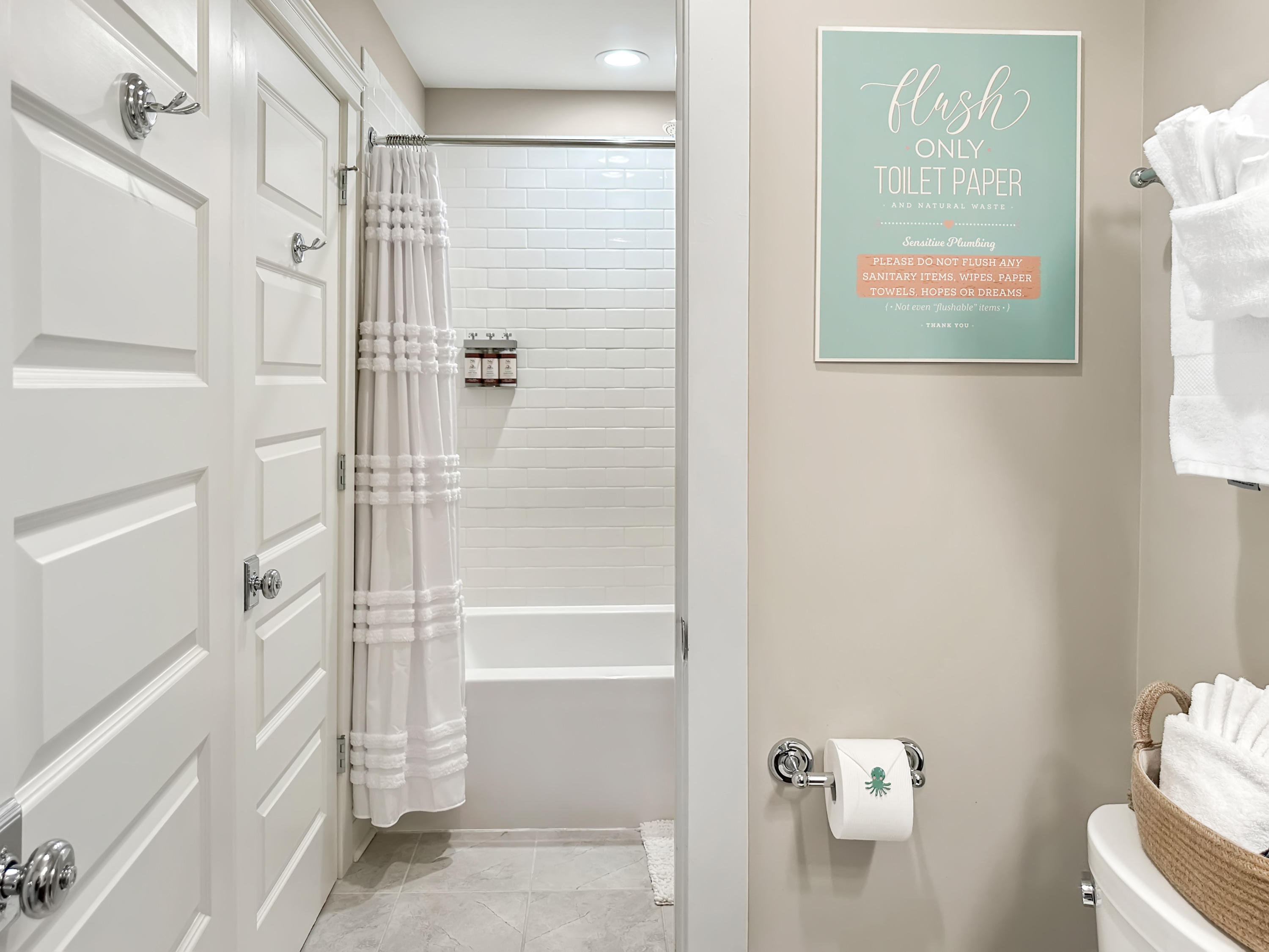 The en-suite bathroom has a tub/shower combo...