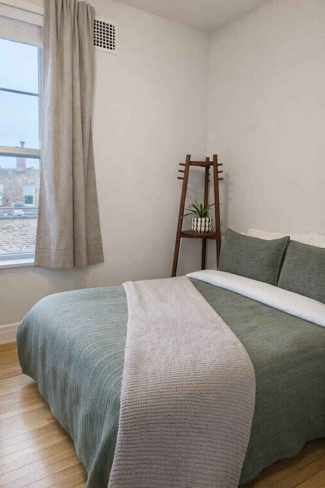 Bedroom detail with soft linens and comfortable mattress.