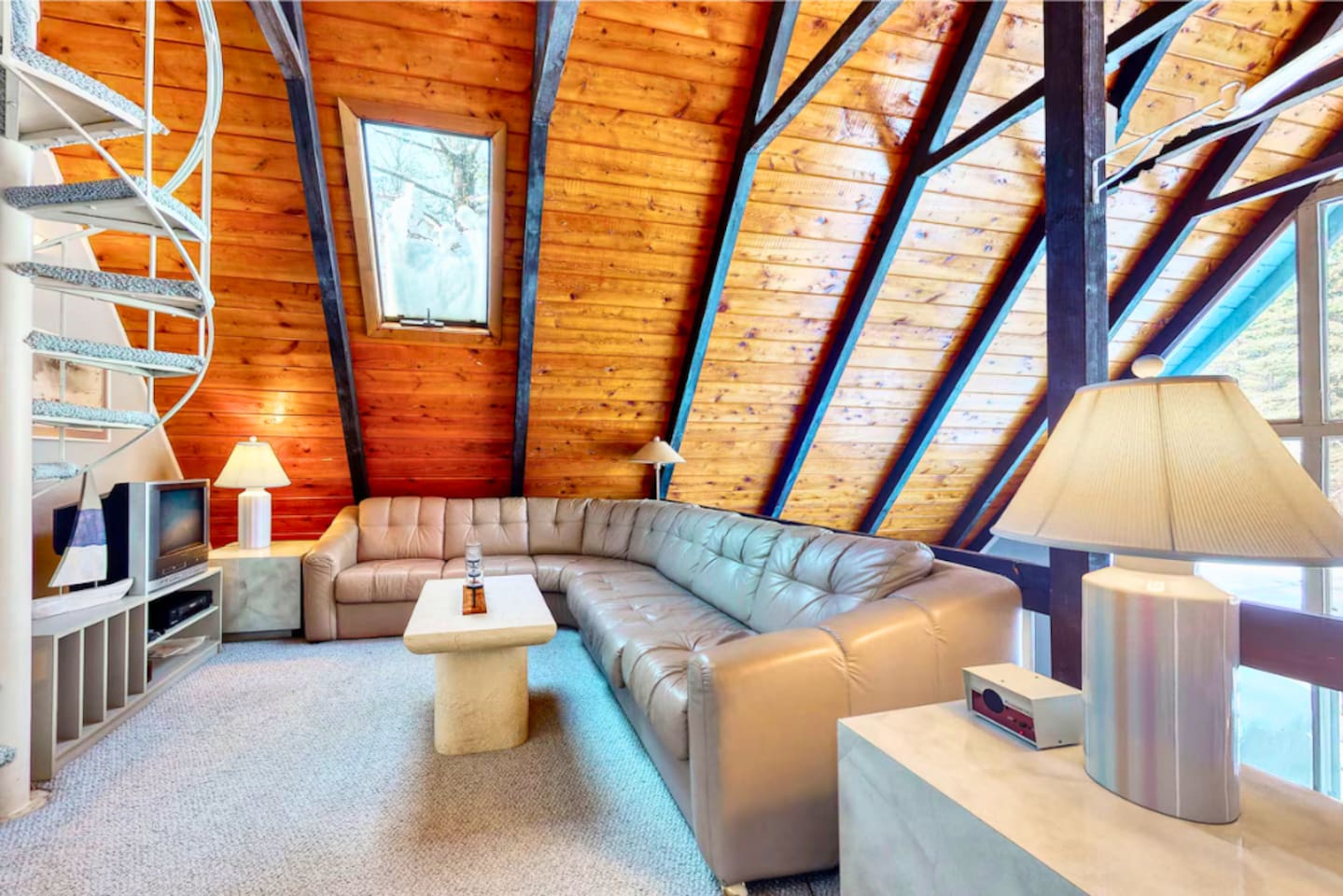 Relax on the L couch that is on the second floor landing overlooking the living room! 