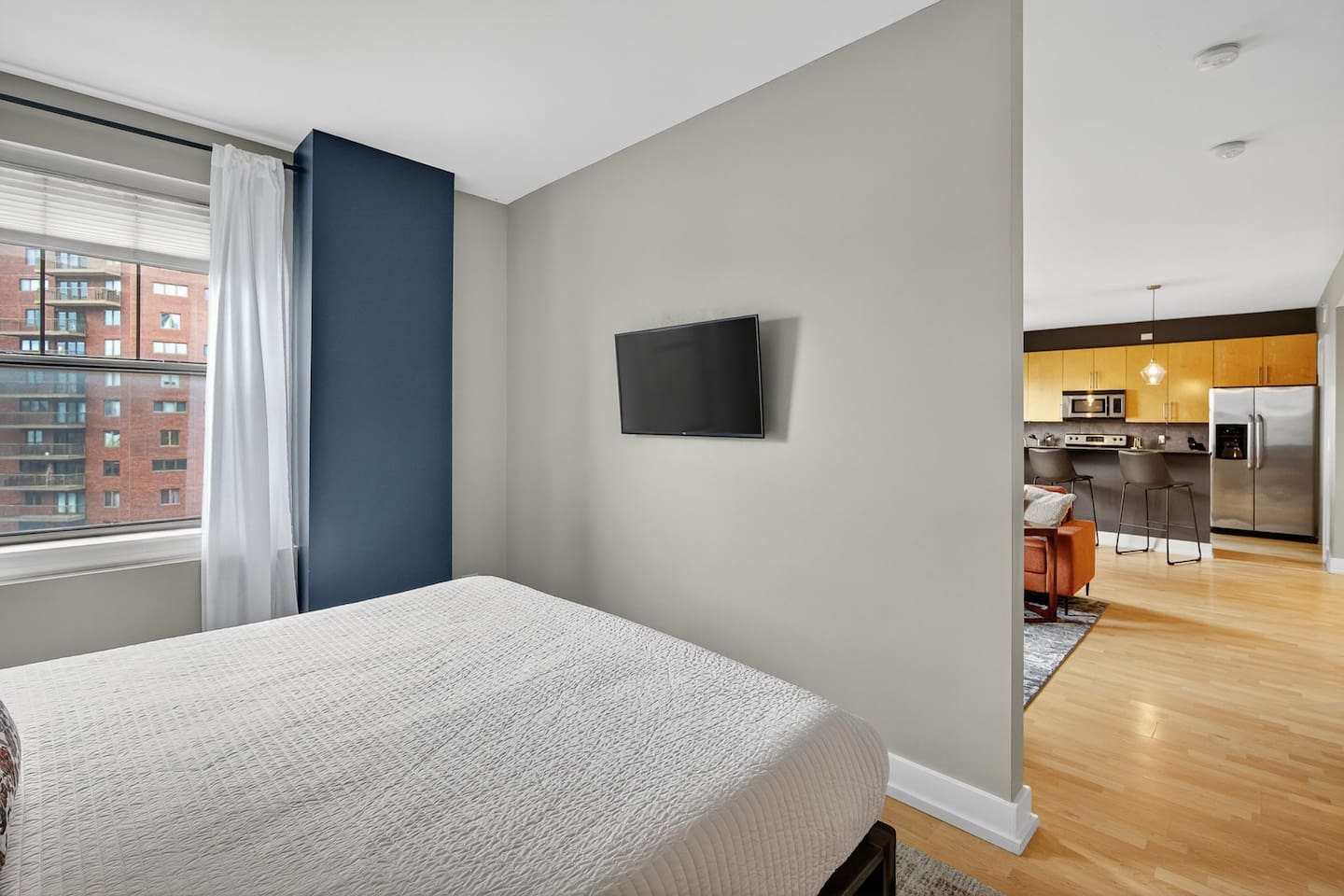 Enjoy a bright, airy bedroom that flows directly into the living and kitchen areas. City views, smart design, and modern comforts create a welcoming space to rest, recharge, and feel at home in the heart of Des Moines.