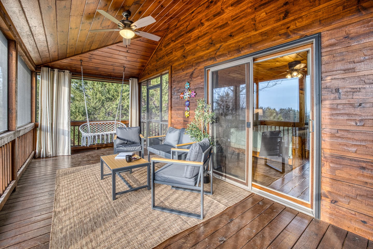 Mountain views from the wrap-around porch, especially the screened in porch in the back with comfy cozy outdoor furniture. 