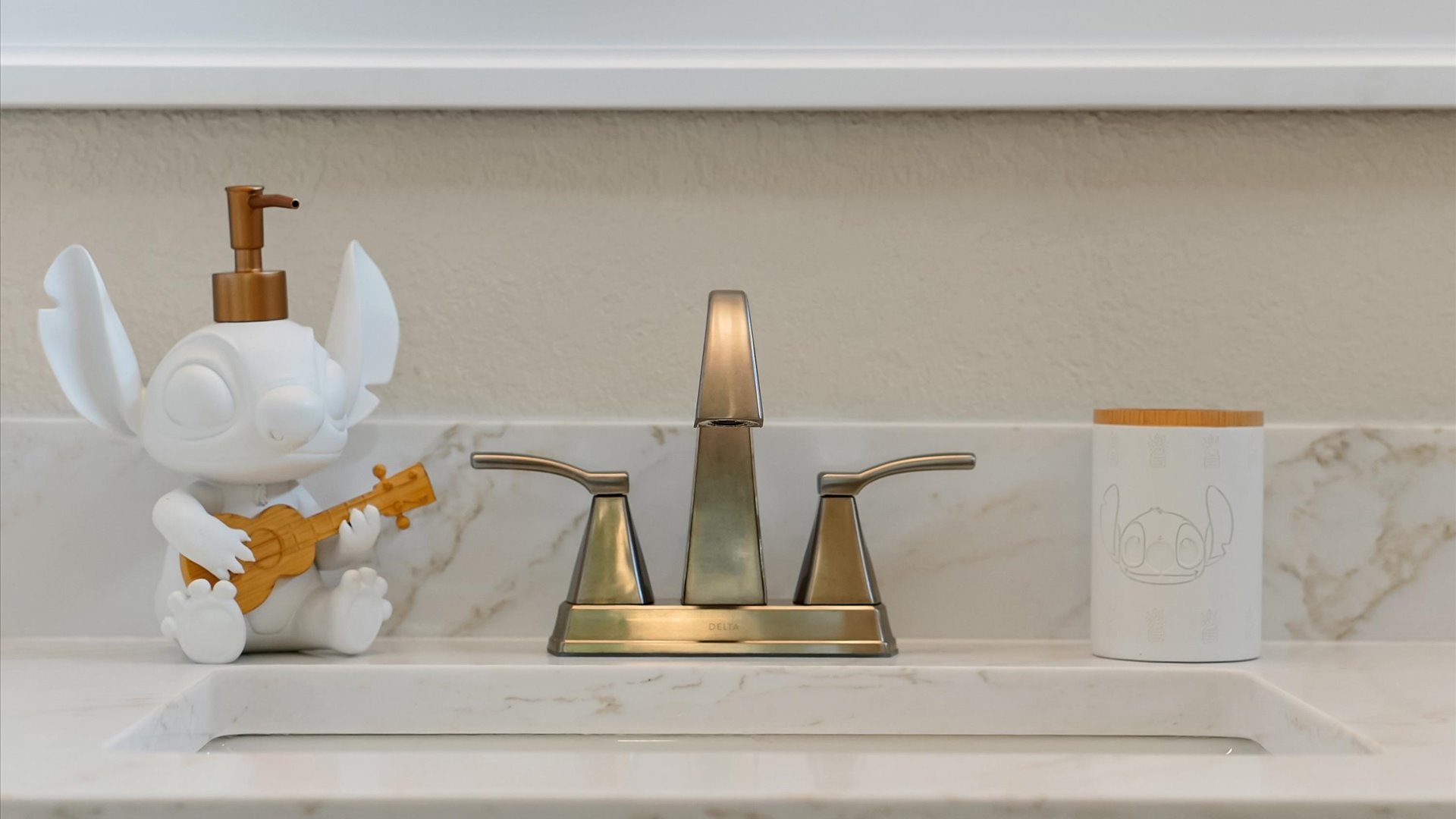 Stitch Queen Retreat Ensuite: Playful Stitch-inspired bathroom accessories add a touch of island charm to the renovated ensuite.