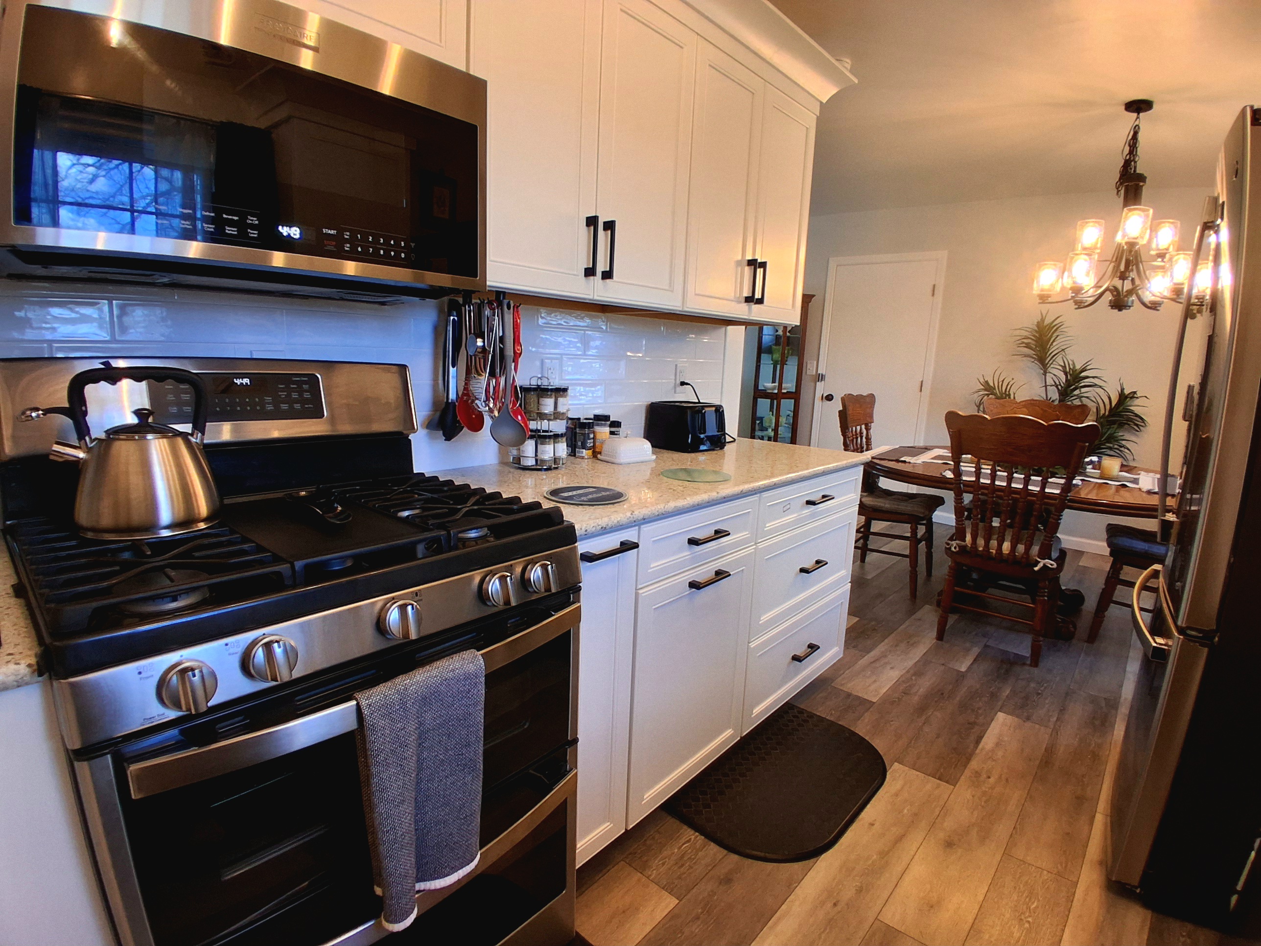 This double oven gas stove is a dream. The center top is a griddle for cooking big batches, and it features air fryer, convection, and standard bake modes. It self-cleans with steam and offers both a small top oven and a spacious bottom one.