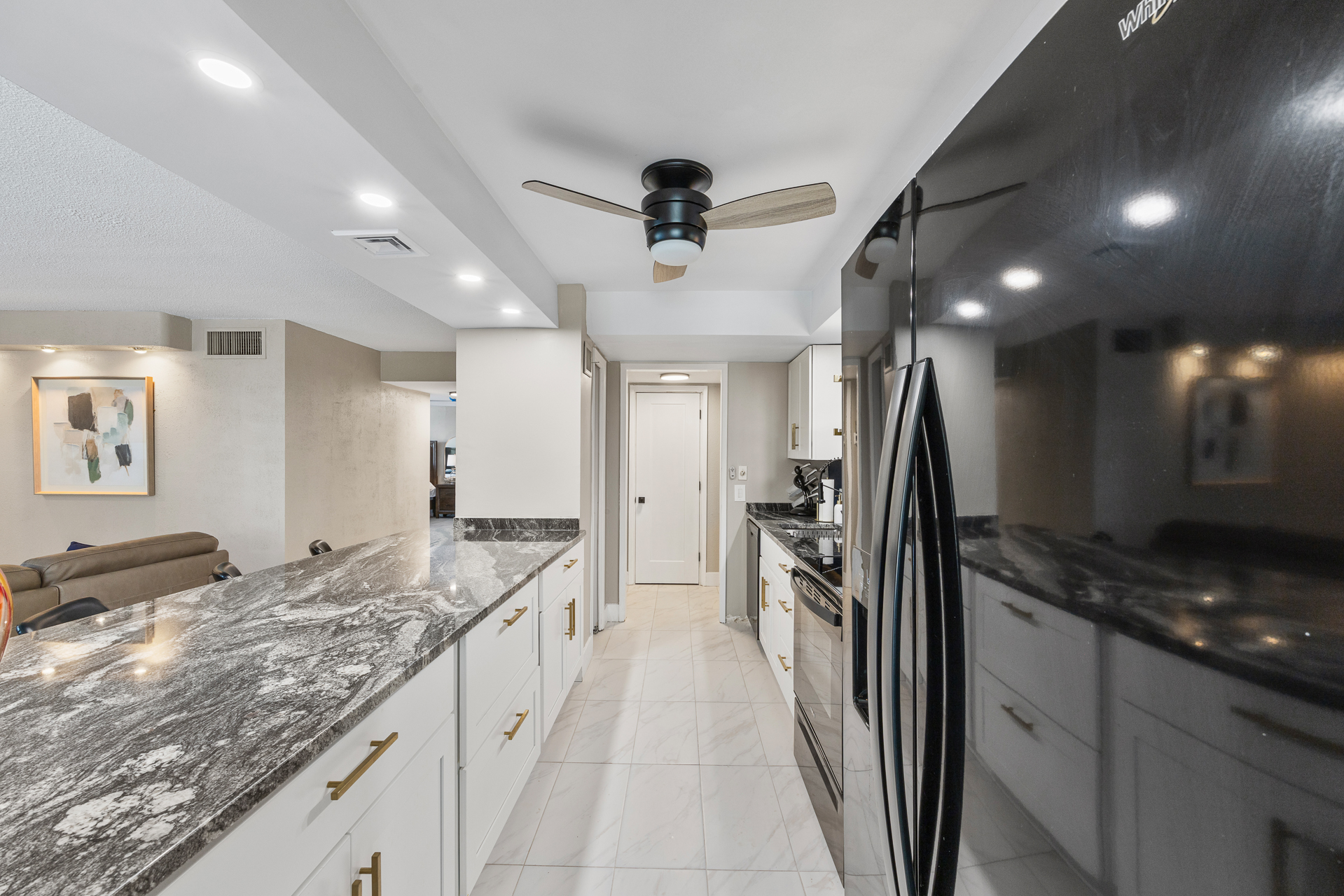 Fully stocked kitchen with cookware, plates, utensils, and all your dining essentials — plus a refrigerator with built-in ice maker and water filter.