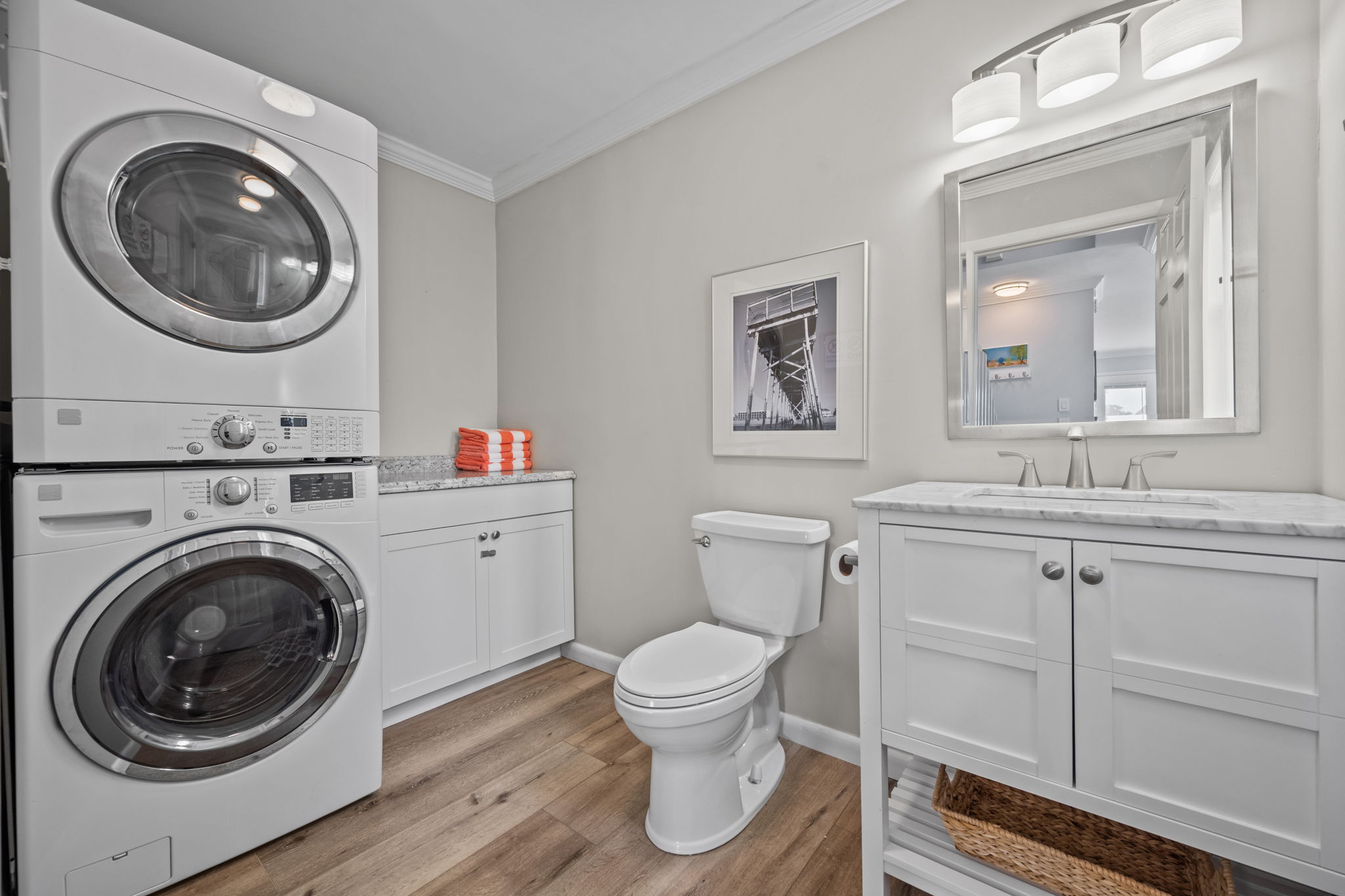 Refresh and recharge in this modern half bathroom, complete with a washer and dryer for added convenience.