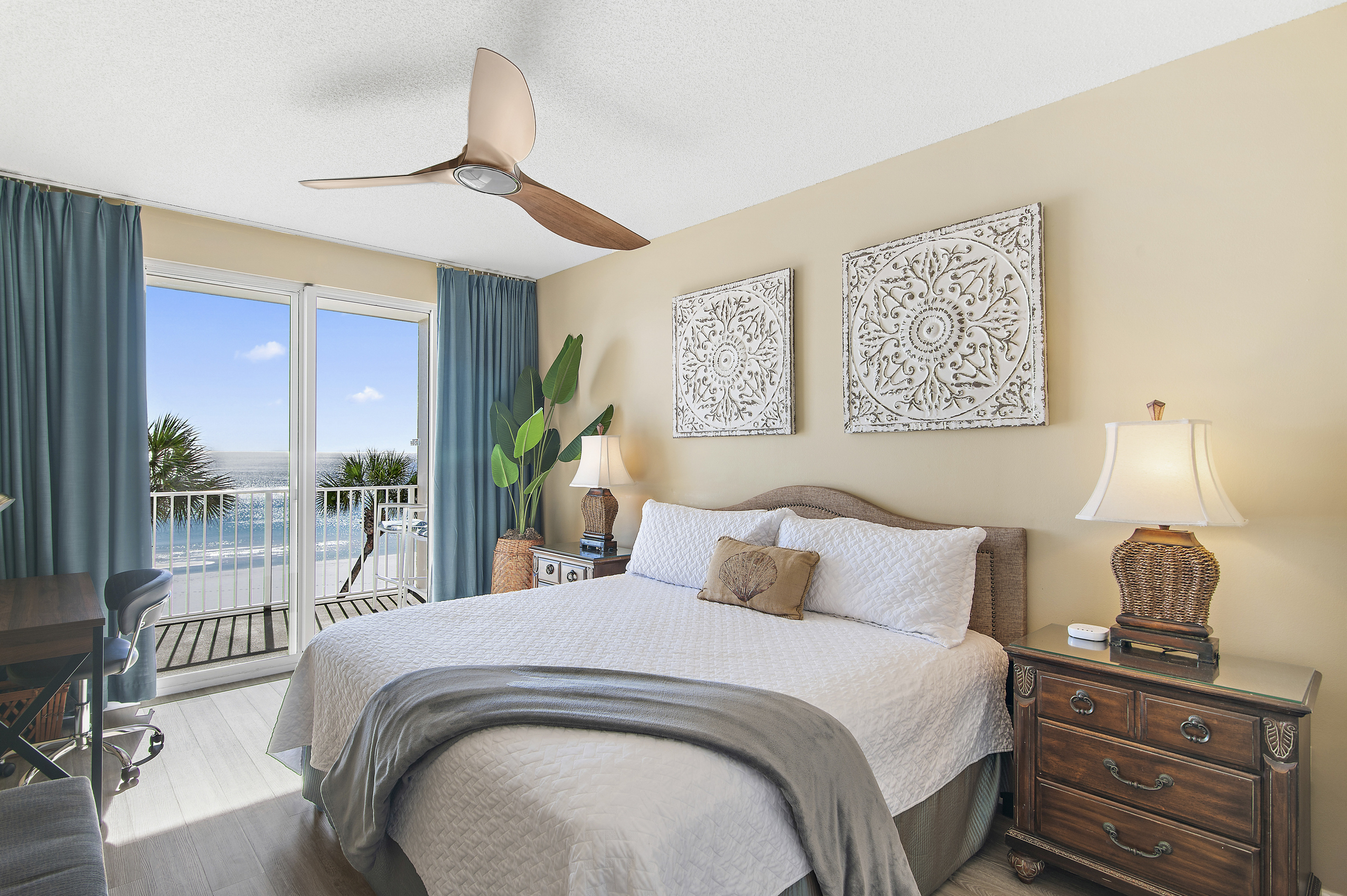 Spacious master bedroom is beautifully decorated and features a King bed, Gulf views, Desk and Chair, balcony access, SMART TV w/ cable access, private bathroom, and large closet.