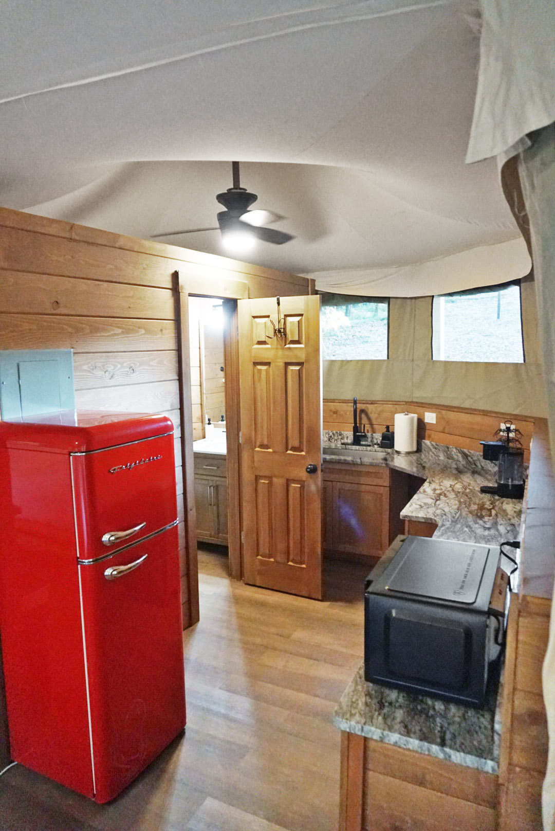 Gourmet Kitchenette: Vintage red fridge and modern amenities create a fun cooking vibe!