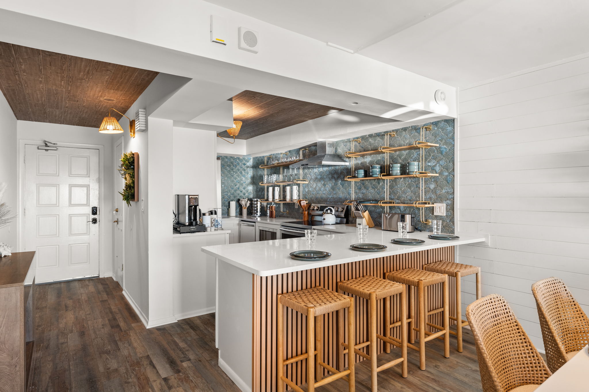 The kitchen counter has seating for 4