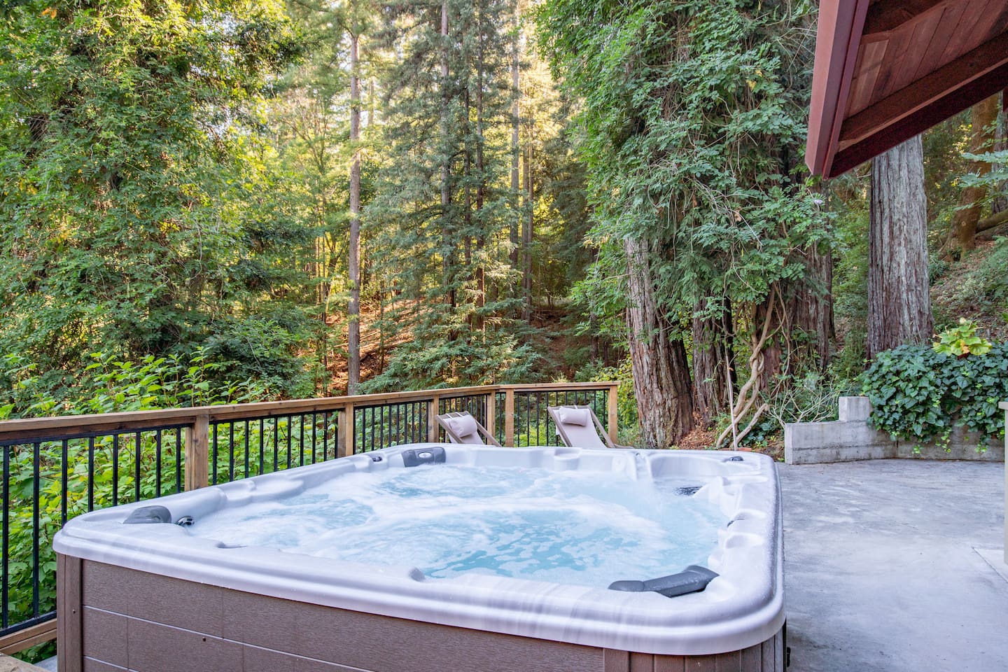 Enjoy nature's serenity and relax in our hot tub with stunning forest views.