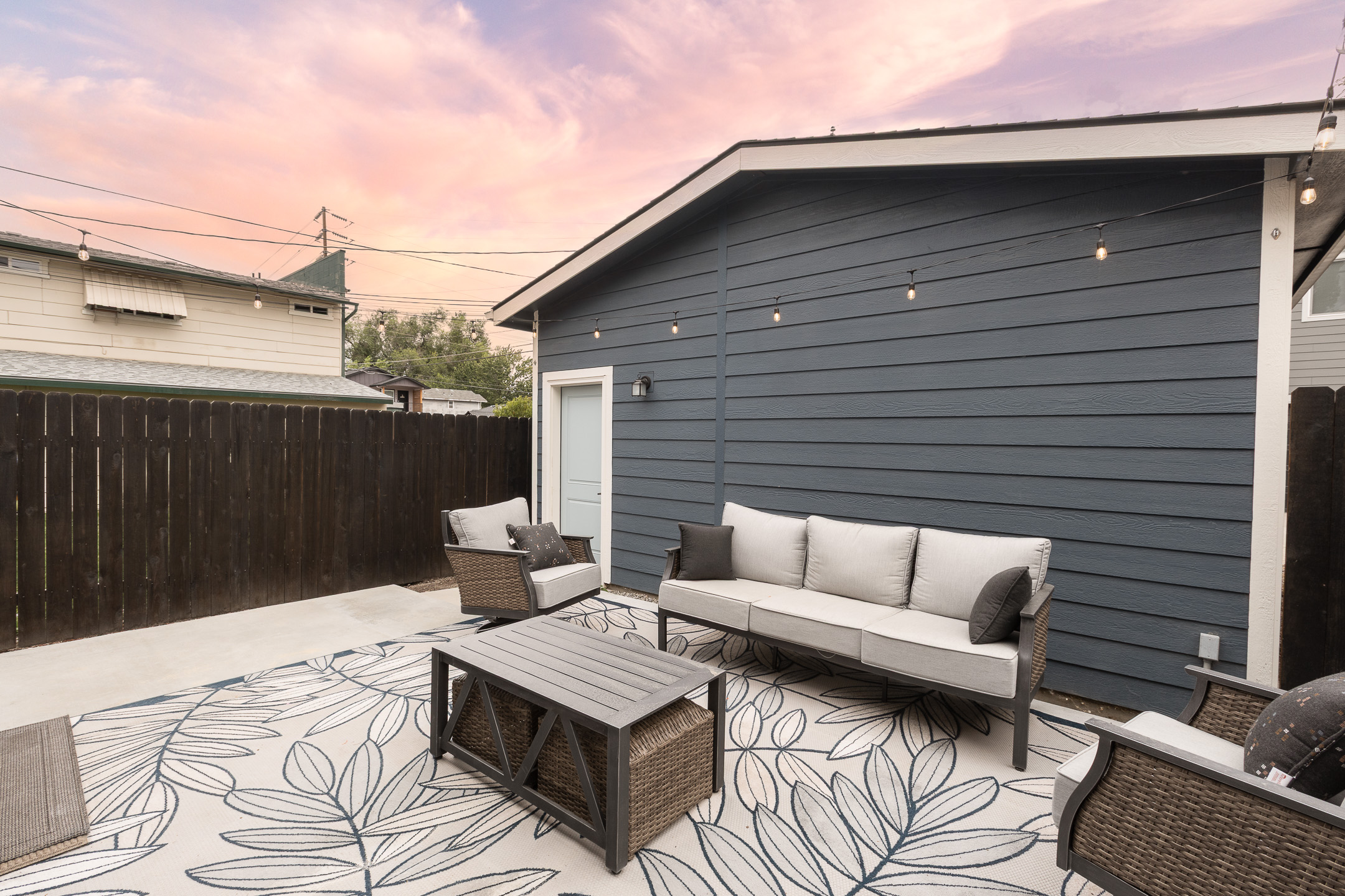 Private patio leads to a double garage for parking