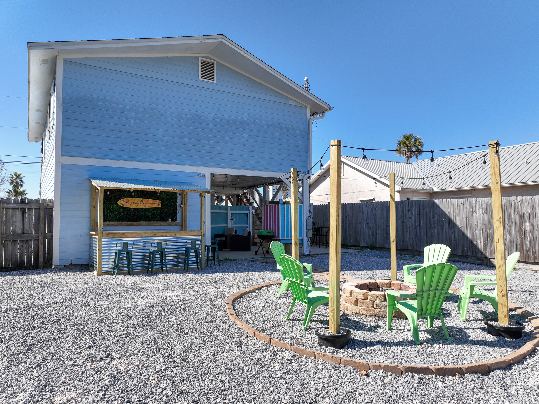 New backyard transformation including new landscape and professional cornhole boards and bags