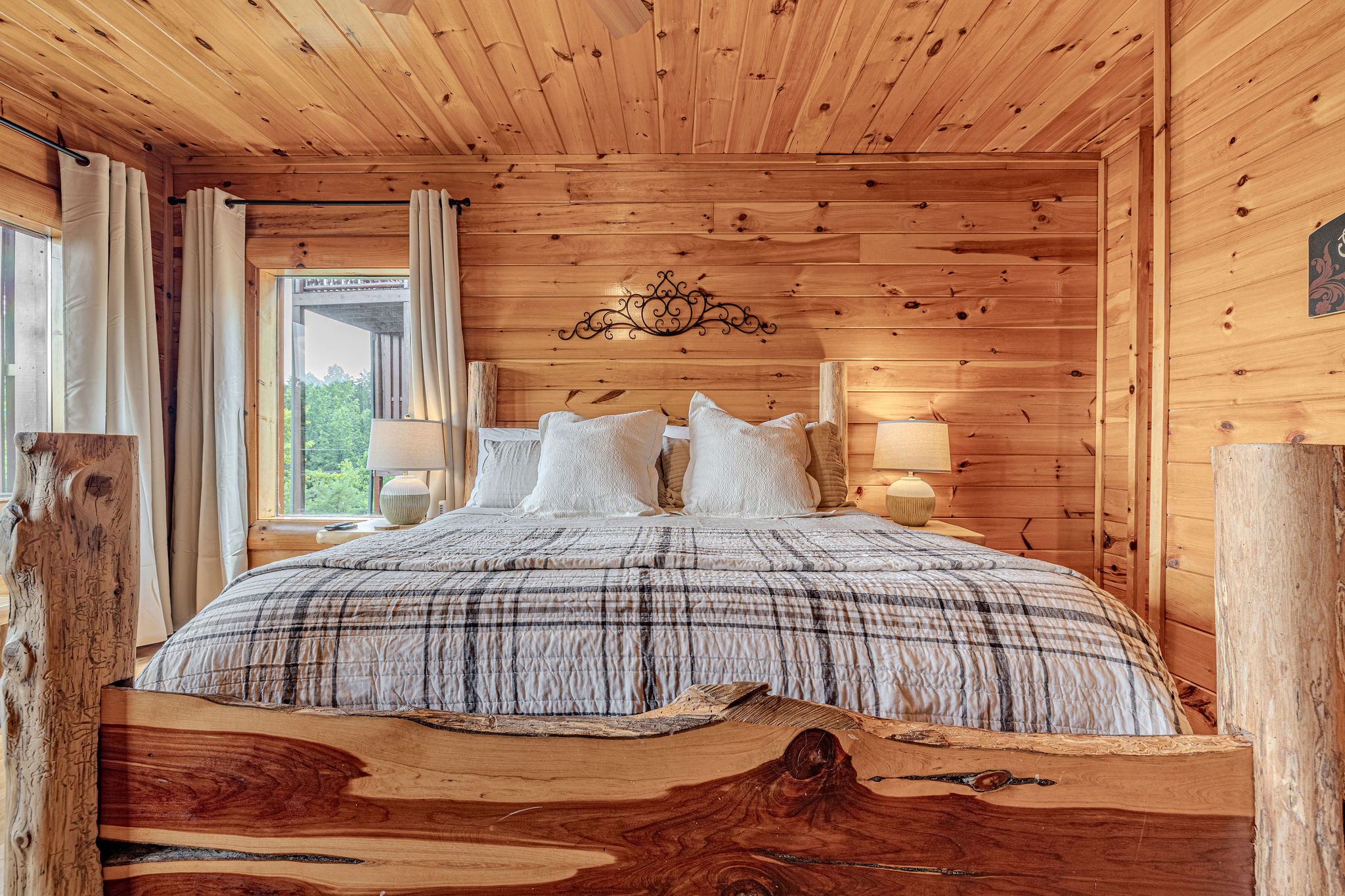 Primary suite with rustic King log bed.