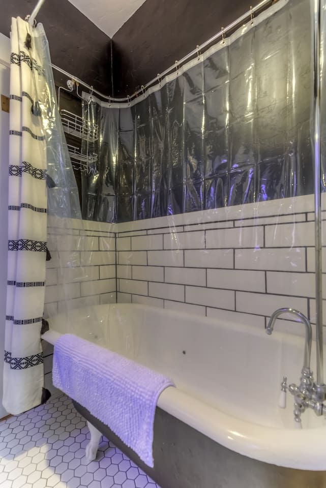 claw foot tub with shower enclosure